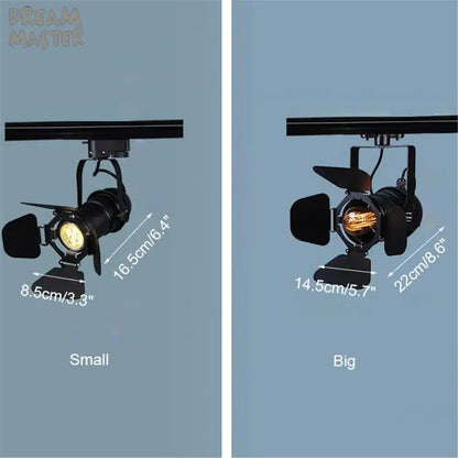 Industrial black spotlight rail light with adjustable barn doors and exposed filament bulbs for commercial store lighting decorbites industrial spotlight
