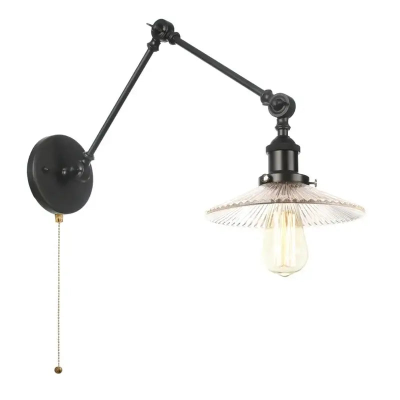 Industrial black swing arm wall light fixture with wrought iron frame and clear ribbed glass shade with exposed edison bulb