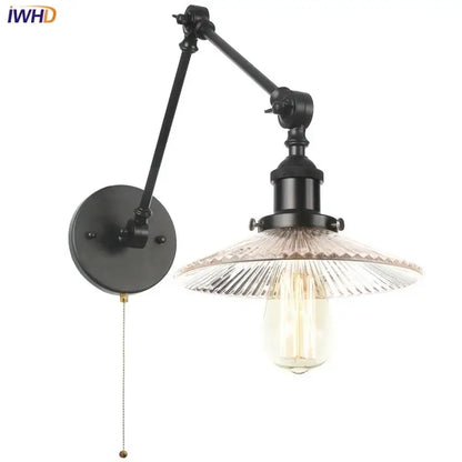 Industrial black wrought iron adjustable wall light fixture with swing arm and faceted glass shade with edison bulb