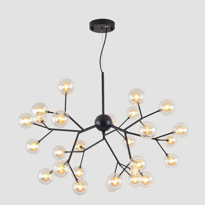 Industrial black tree branch chandelier featuring multiple clear decorbites glass ball firefly bulbs for dining room decor