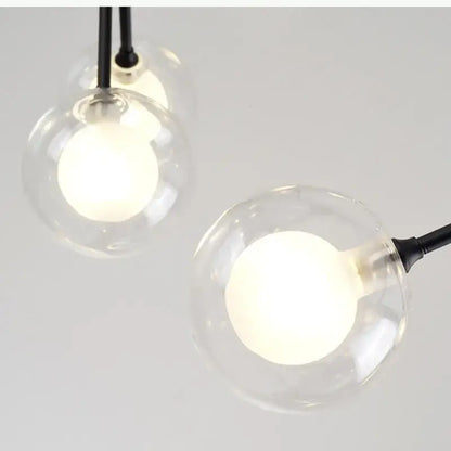 Clear glass globe pendant lights with black cords in industrial black tree branch glass ball firefly chandelier decorbites