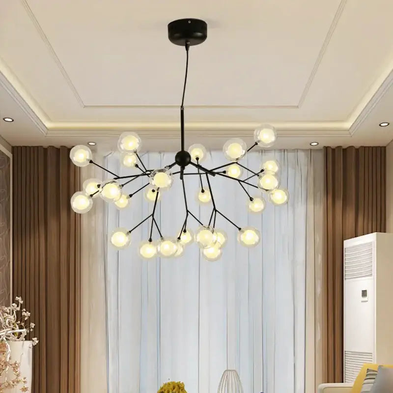 Industrial black tree branch chandelier with multiple clear glass ball firefly bulbs for dining room decorbites decor