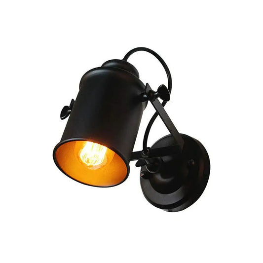 Industrial black vintage wall light with adjustable arm and warm interior featuring a glowing filament bulb for decorbites industrial vintage style