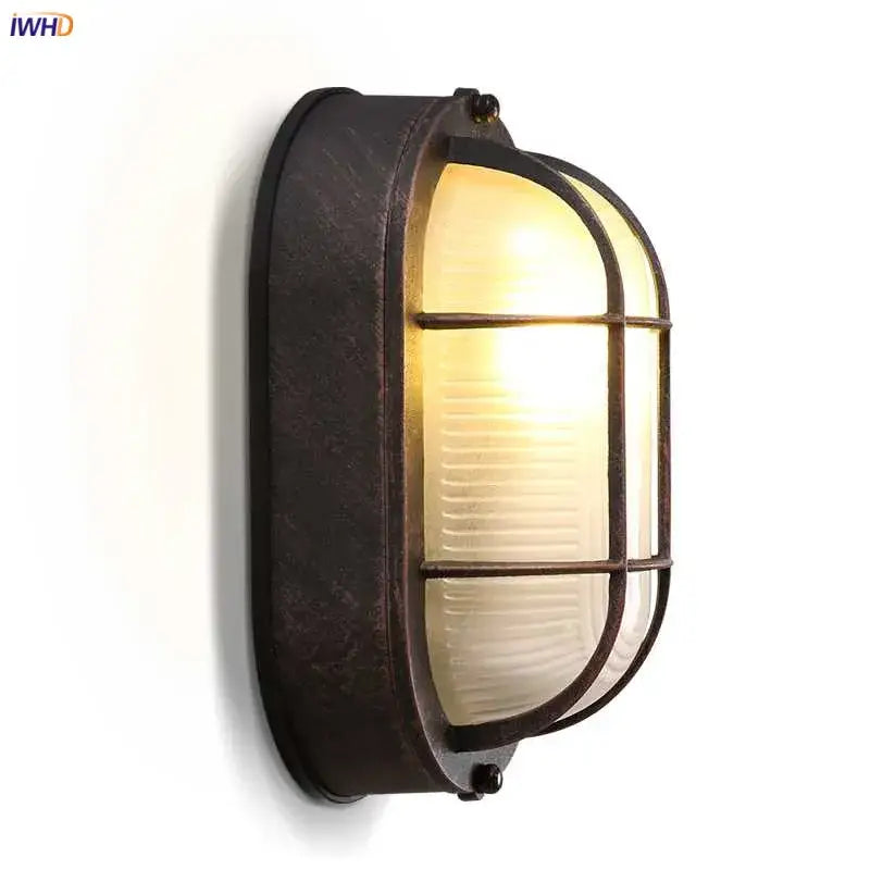 Rustic bronze-finished wall lamp with ribbed frosted glass and protective cage for industrial glass wall stairway lighting