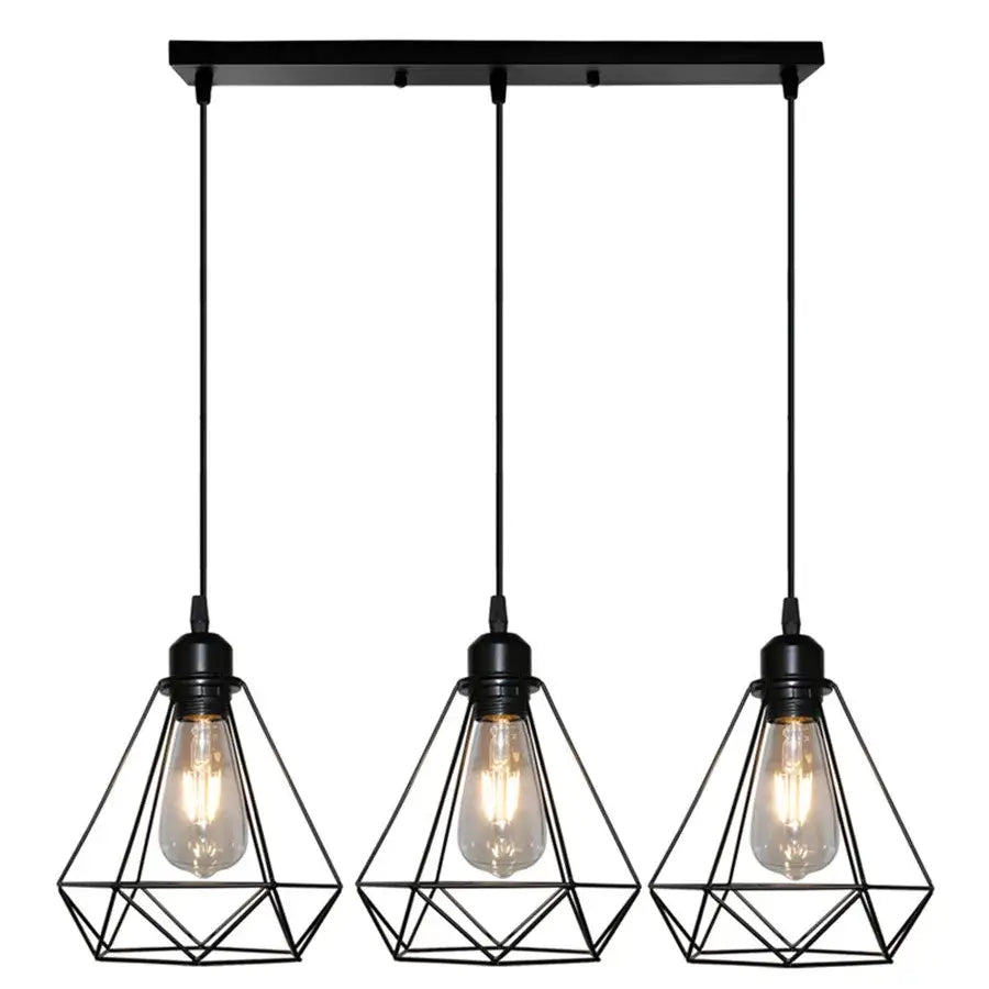 Black geometric pendant light with three exposed Edison bulbs featuring diamond cage wrought iron design for kitchen