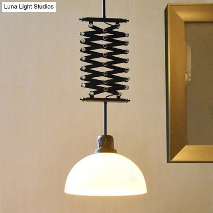 Black metal accordion-style pendant light with frosted glass dome shade in black white finish for industrial decor
