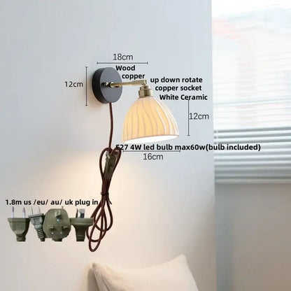 Industrial black wood led wall sconce with brass accent featuring a vintage wood and copper base and white ceramic shade