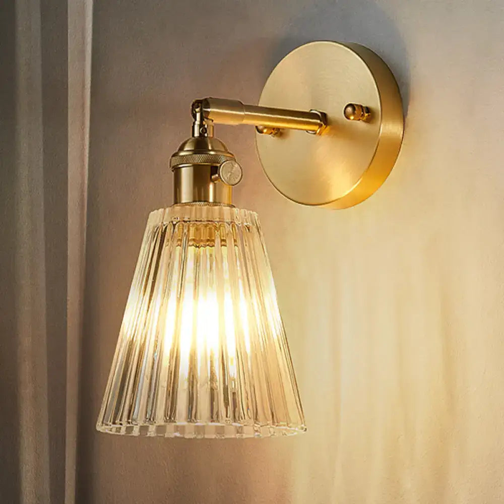 Gold-toned DecorBites™ clear textured glass wall sconce with brass accents for industrial dining room lighting inch fixture