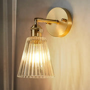 Gold-toned DecorBites™ clear textured glass wall sconce with brass accents for industrial dining room lighting inch fixture