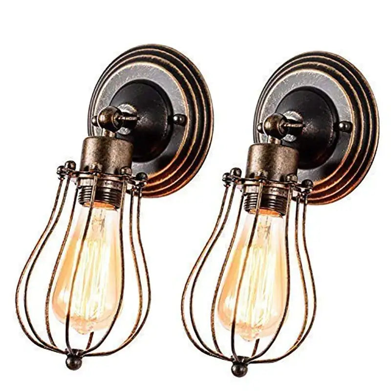 Pair of industrial cage wall sconces with brass-finished metal cages and exposed Edison bulbs for vintage bedroom decorbites industrial cage