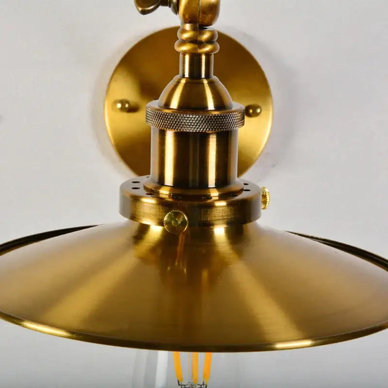 Brass-finished industrial decorbites adjustable long arm wall lamp with flared dome shade and knurled accents for bedroom