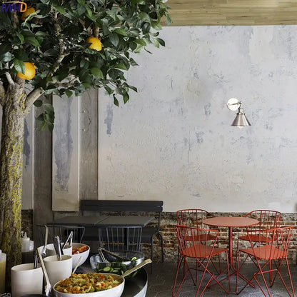 Red metal folding chairs with wireframe design complement industrial brass edison wall light bathroom adjustable sconce decorbites brass edison wall