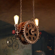 Decorbites antique gear pendant light with brass gear, red valve accents, and two exposed edison bulbs for dining room