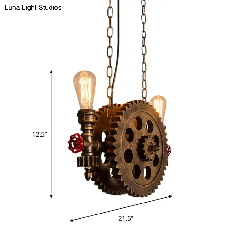 DecorBites antique gear pendant light with brass gears, exposed filament bulbs, and red valve accents for dining room