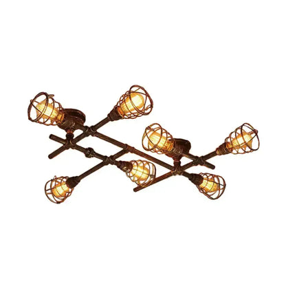 Industrial brass intersecting piping ceiling light with six edison bulbs in dark bronze wrought iron cages for dining room
