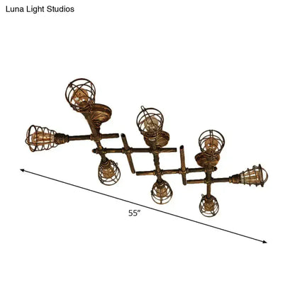Industrial brass intersecting piping ceiling light with five exposed filament bulbs in wire cages for dining room use