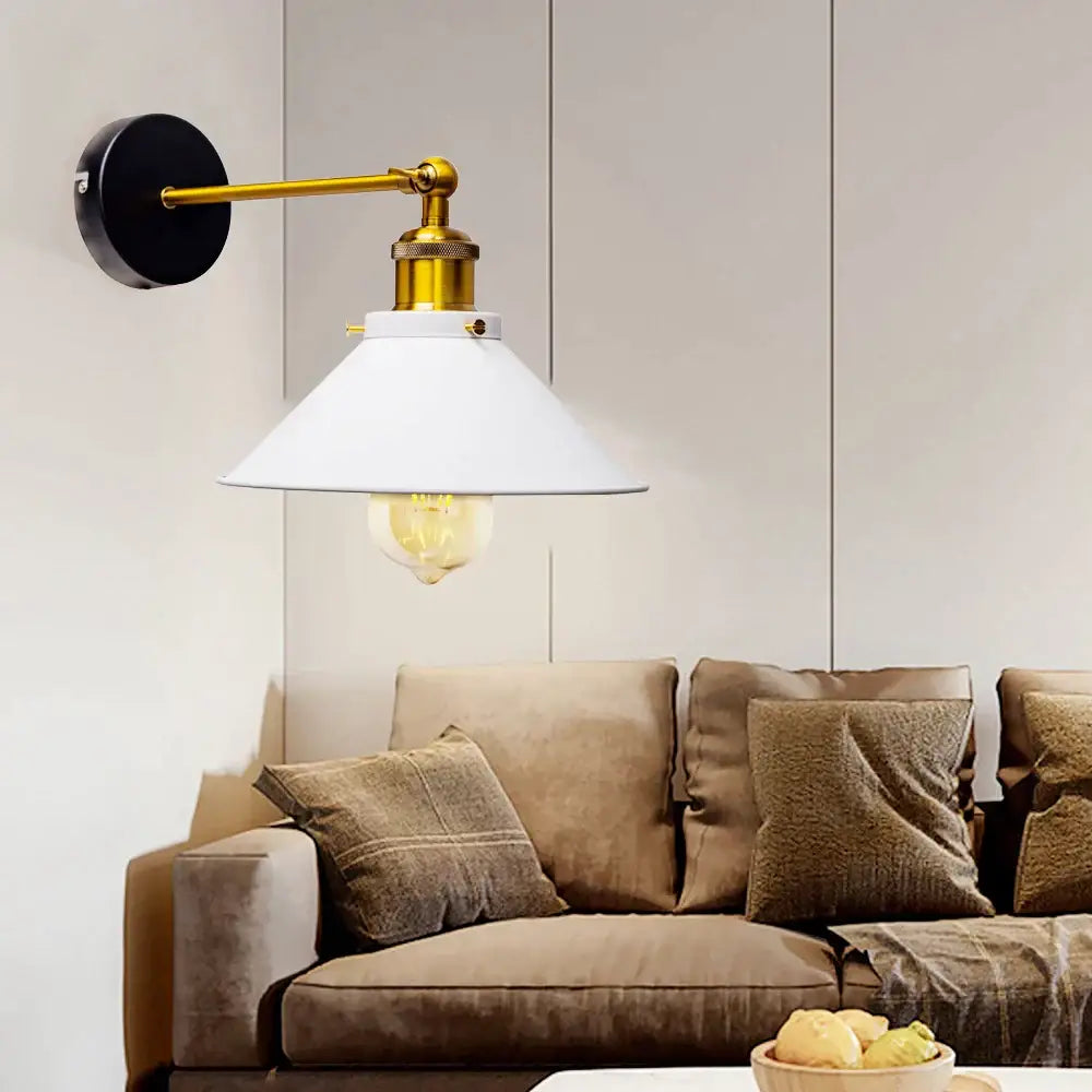 Industrial brass led wall lamp with black base and white conical shade featuring exposed filament bulb for bedroom lighting