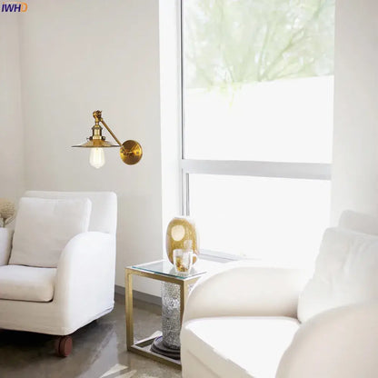 Brass long arm led wall light with classic industrial design and exposed bulb for bedroom sconce lighting