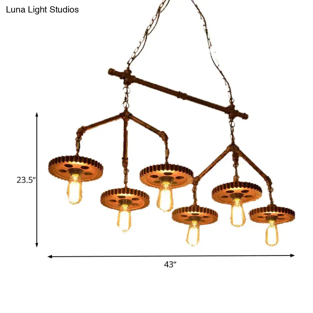 Industrial brass pipe island light fixture with rust finish metal gear chandelier and five exposed Edison bulbs