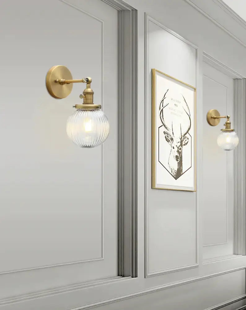 Gold-finished wall sconces with industrial ribbed glass globe designed for kitchen decorbites industrial ribbed lighting