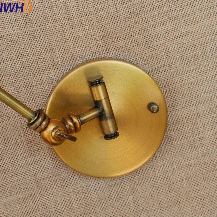 Antique brass industrial led wall lamp with circular base and adjustable swing arm for bedroom reading light