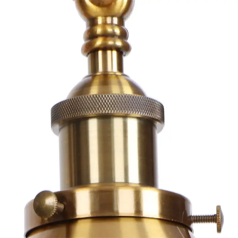 Brass-finished industrial wall sconce lamp socket with pull chain switch and textured knurled ring and adjustable screws