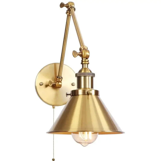 Industrial brass wall sconce with pull chain switch featuring adjustable conical shade and exposed bulb for bedroom use