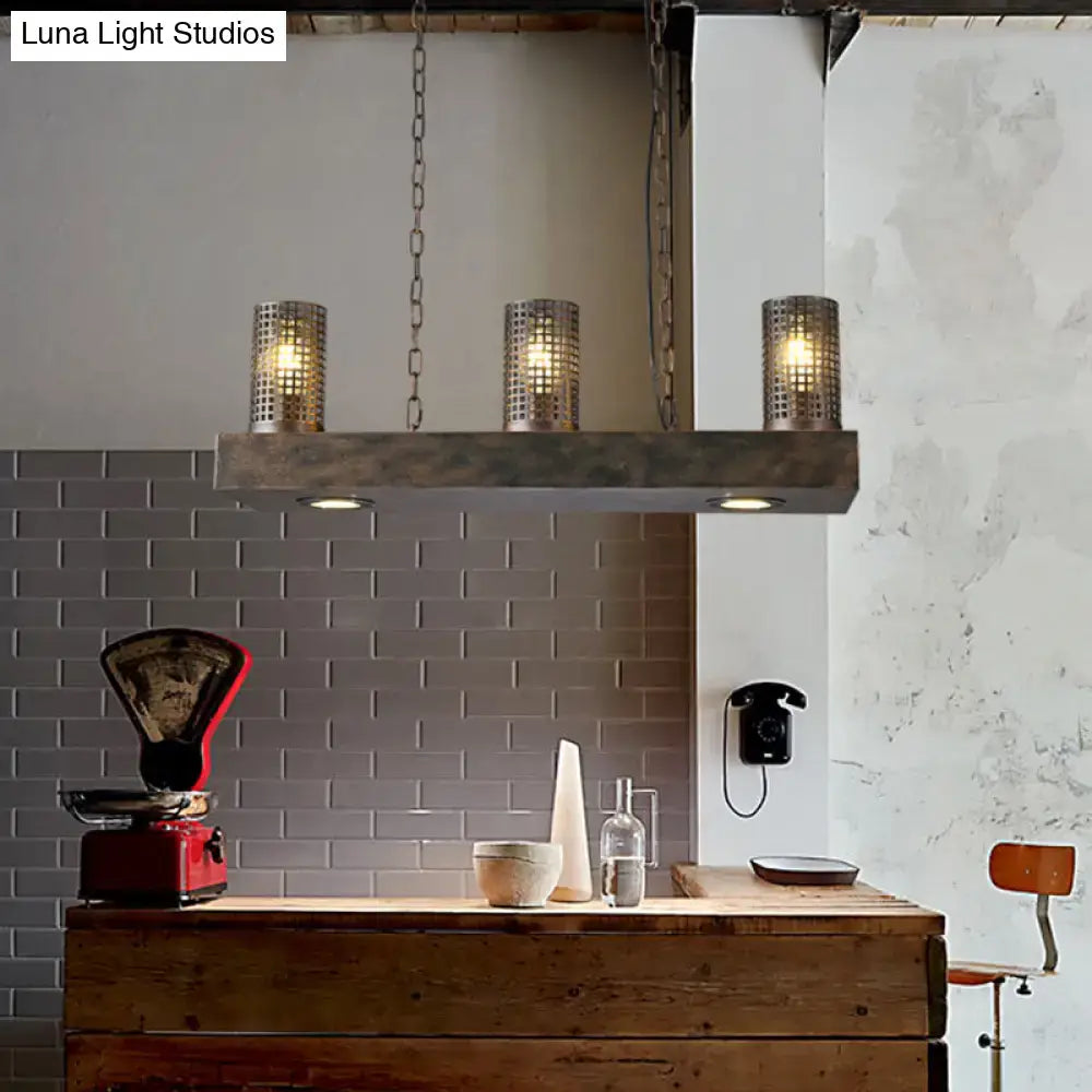 Industrial bronze and black hanging ceiling light with three perforated cylinder metal shades suspended by chains