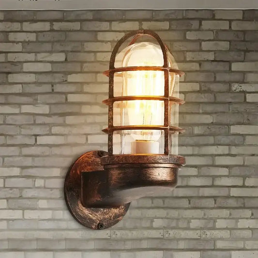 Rustic bronze-finished industrial iron cage guard wall sconce with clear glass lantern for bedroom decorbites iron cage