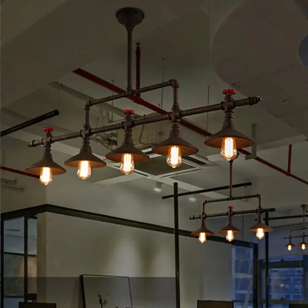 Industrial bronze pipe island light five bulb pendant with exposed brass and black metal pipes and vintage Edison bulbs