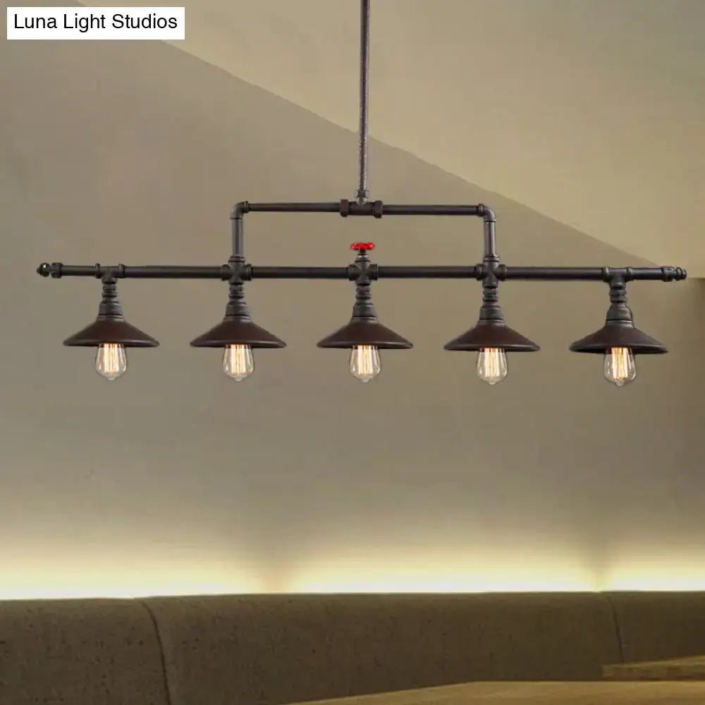 Industrial bronze pipe island light pendant with five exposed filament bulbs and red valve accent for dining room