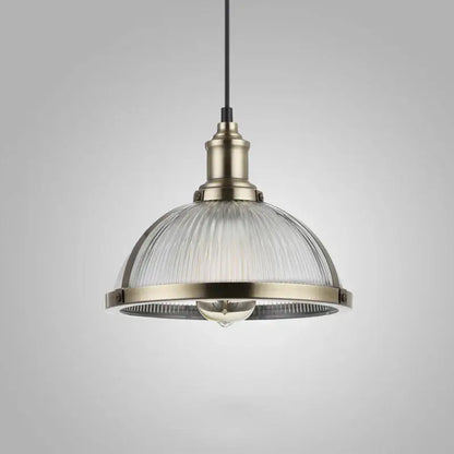 Industrial brushed nickel pendant light with brass metal frame and clear ribbed glass shade for dining room use