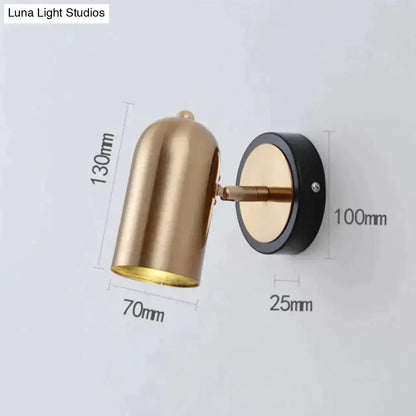 Gold-toned industrial led wall sconce with sleek finish, black base, adjustable arm, ideal for bedroom spotlight use
