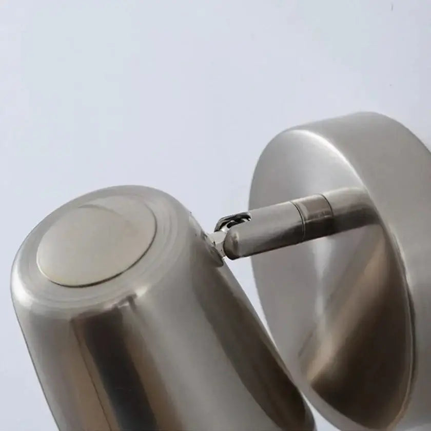 Industrial led wall sconce featuring a stainless steel double-sided wall-mounted kettle with a brushed nickel finish