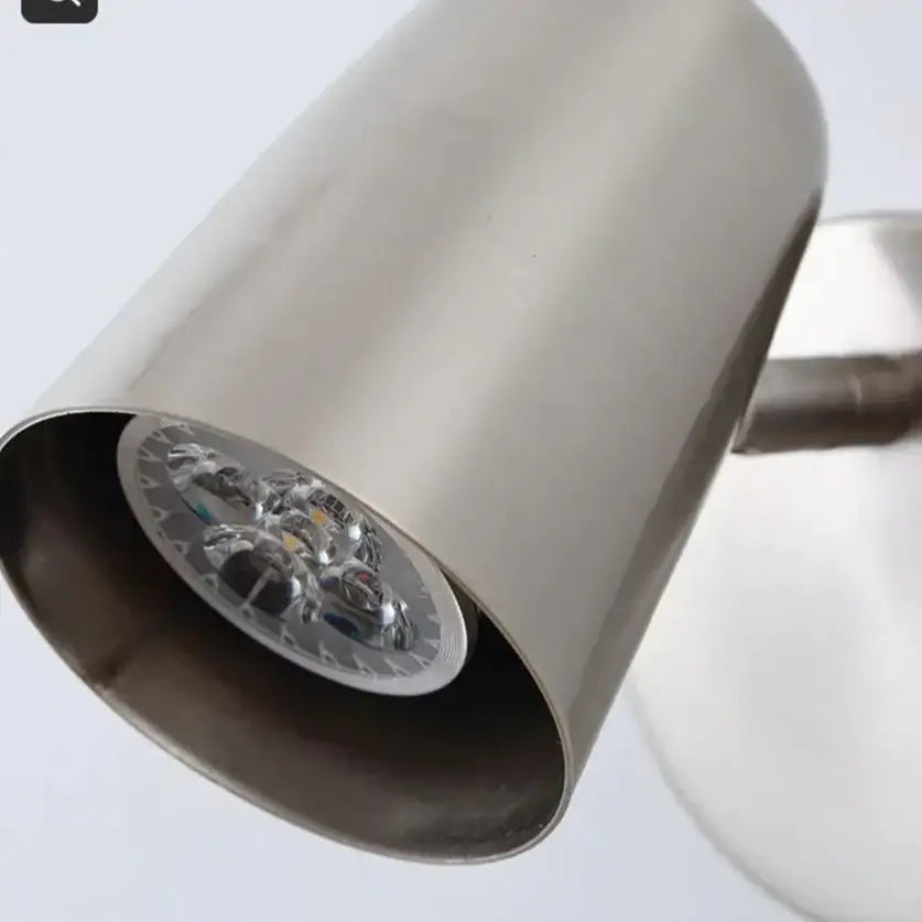 Stainless steel industrial led wall sconce with brushed nickel finish and visible led bulbs for bedroom spotlight use