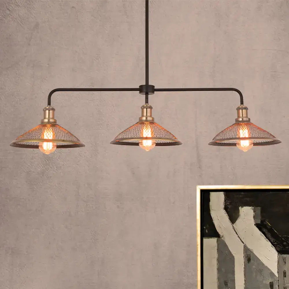 Industrial-style black metal cage flared island pendant light with three brass-finished mesh-shaded lights for dining room