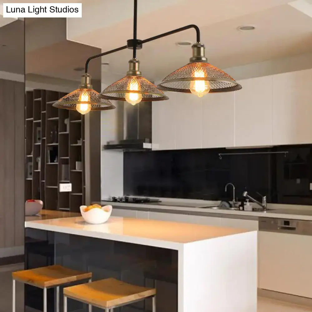 Industrial-style three-light cage flared island pendant light with brass finish and wire mesh shades for dining rooms