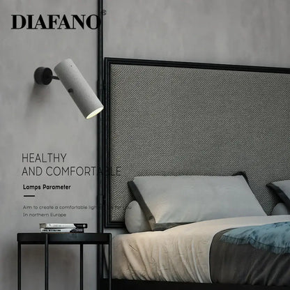Concrete finished cylindrical wall lamp with matte black base by diafano for decorbites industrial cement wall lighting