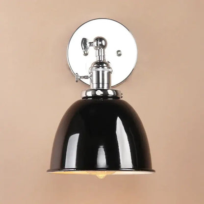 Black enamel dome wall sconce with polished chrome mounting plate and adjustable arm for industrial bedroom lighting