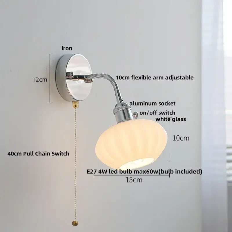 A sleek industrial chrome led wall lamp sconce with flexible arm and white glass shade for bedroom reading light