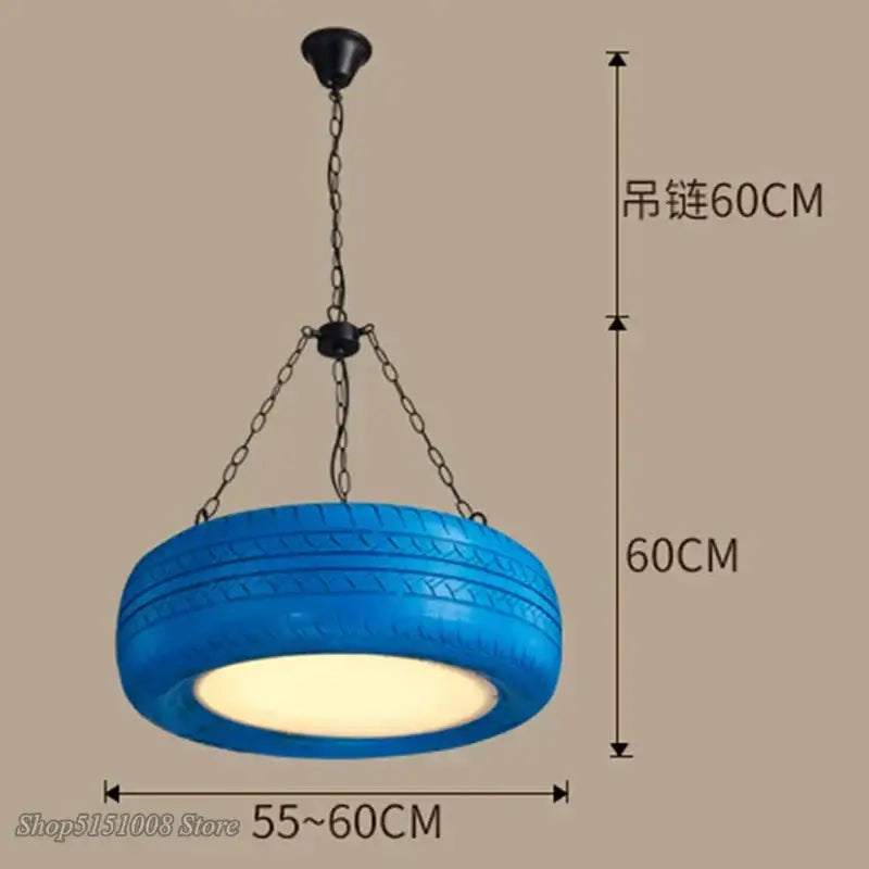 Vibrant blue pendant light made from recycled industrial rubber tire with black metal chain by DecorBites industrial rubber