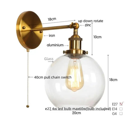 Industrial copper glass globe led bedside lamp with brass finish, clear decorbites glass globe, and adjustable iron arms