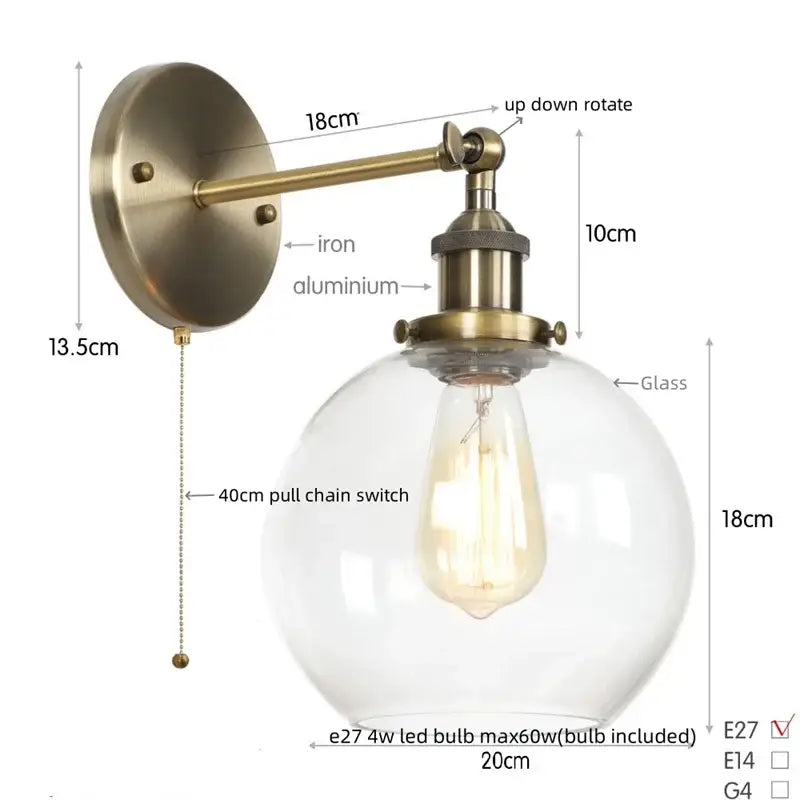 Antique brass-finished wall sconce with a decorbites glass globe led and exposed edison bulb for bedroom lighting