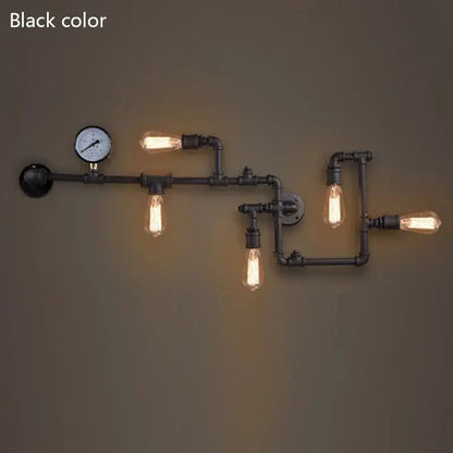 Industrial dark brass pipe wall lights with four exposed filament bulbs and pressure gauge for living room use