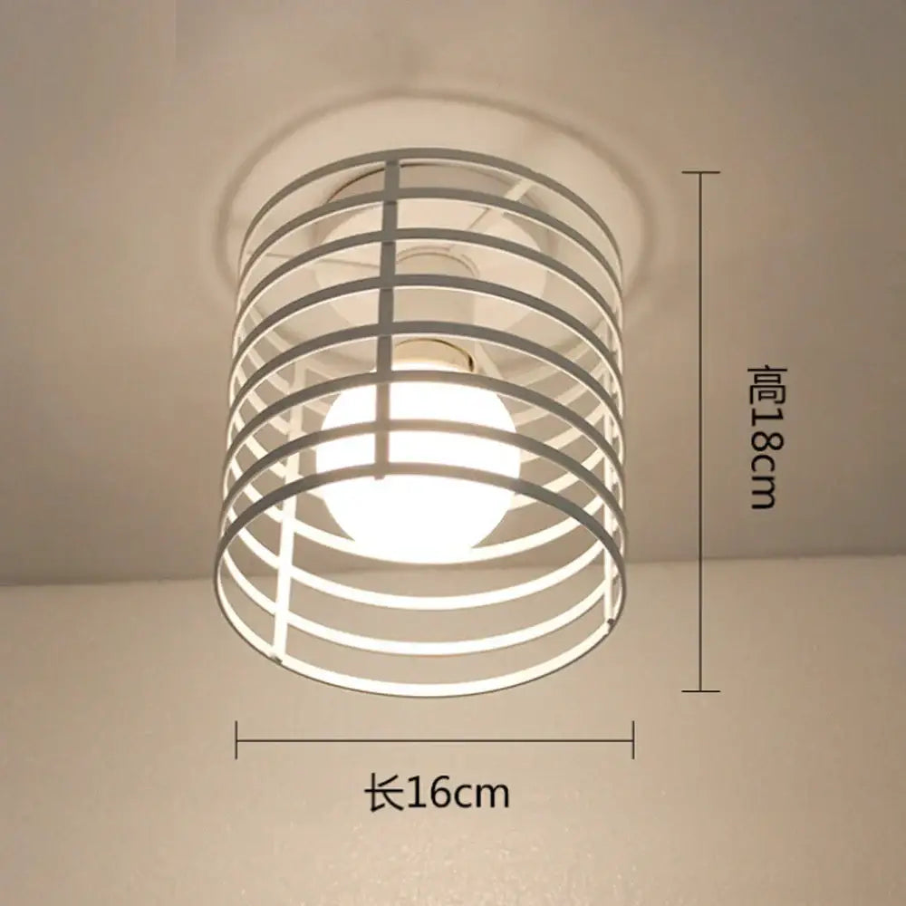 A modern white metal decorbites industrial e27 ceiling lamp with a cylindrical cage design and illuminated bulb for living room