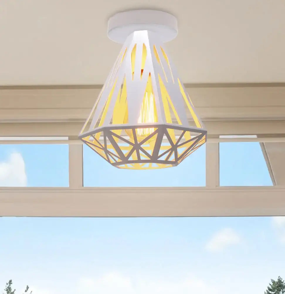 White geometric pendant industrial e27 ceiling lamp with diamond cut-out patterns casting warm yellow glow for living room decorbites industrial e27
