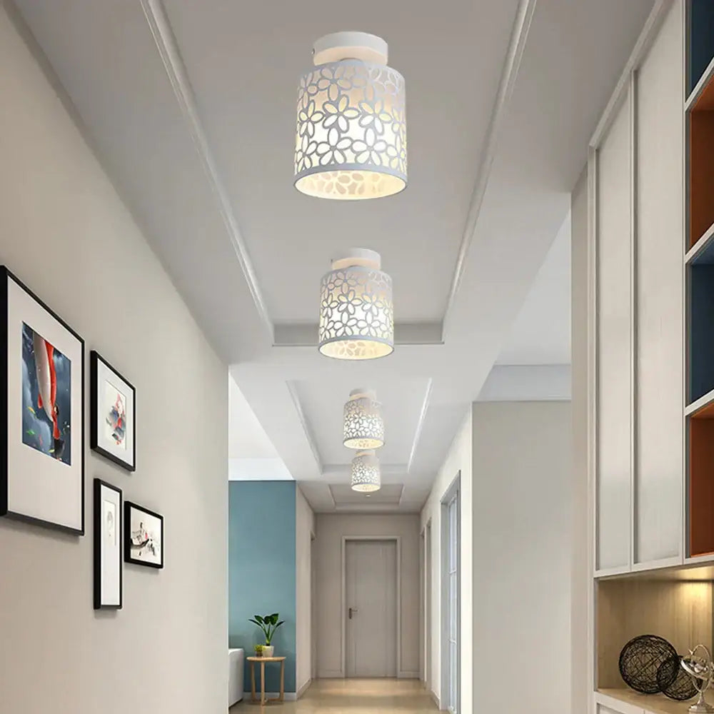 White cylindrical industrial e27 ceiling lamp with delicate floral cutout pattern for modern living room decorbites industrial e27