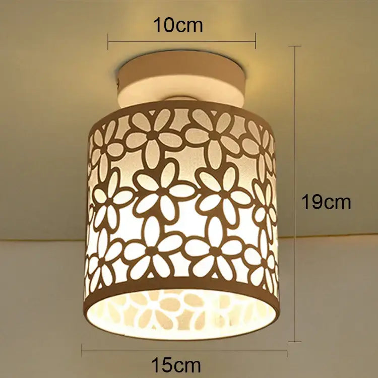 Beige cylindrical industrial e27 ceiling lamp with floral cutout pattern modern geometric decorbites e27 ceiling light