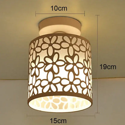 Beige cylindrical industrial e27 ceiling lamp with floral cutout pattern modern geometric decorbites e27 ceiling light