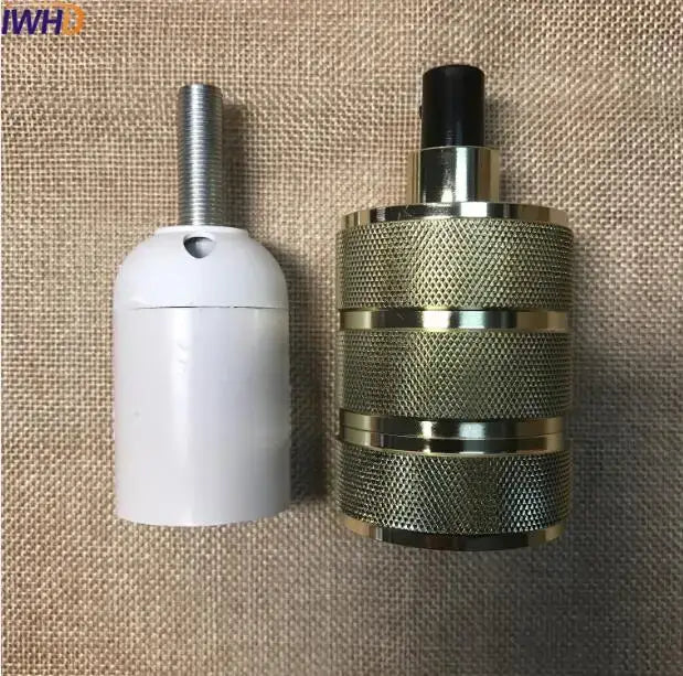 White plastic and metallic threaded decorbites industrial e27 socket lamp holder next to gold-toned textured metal light base